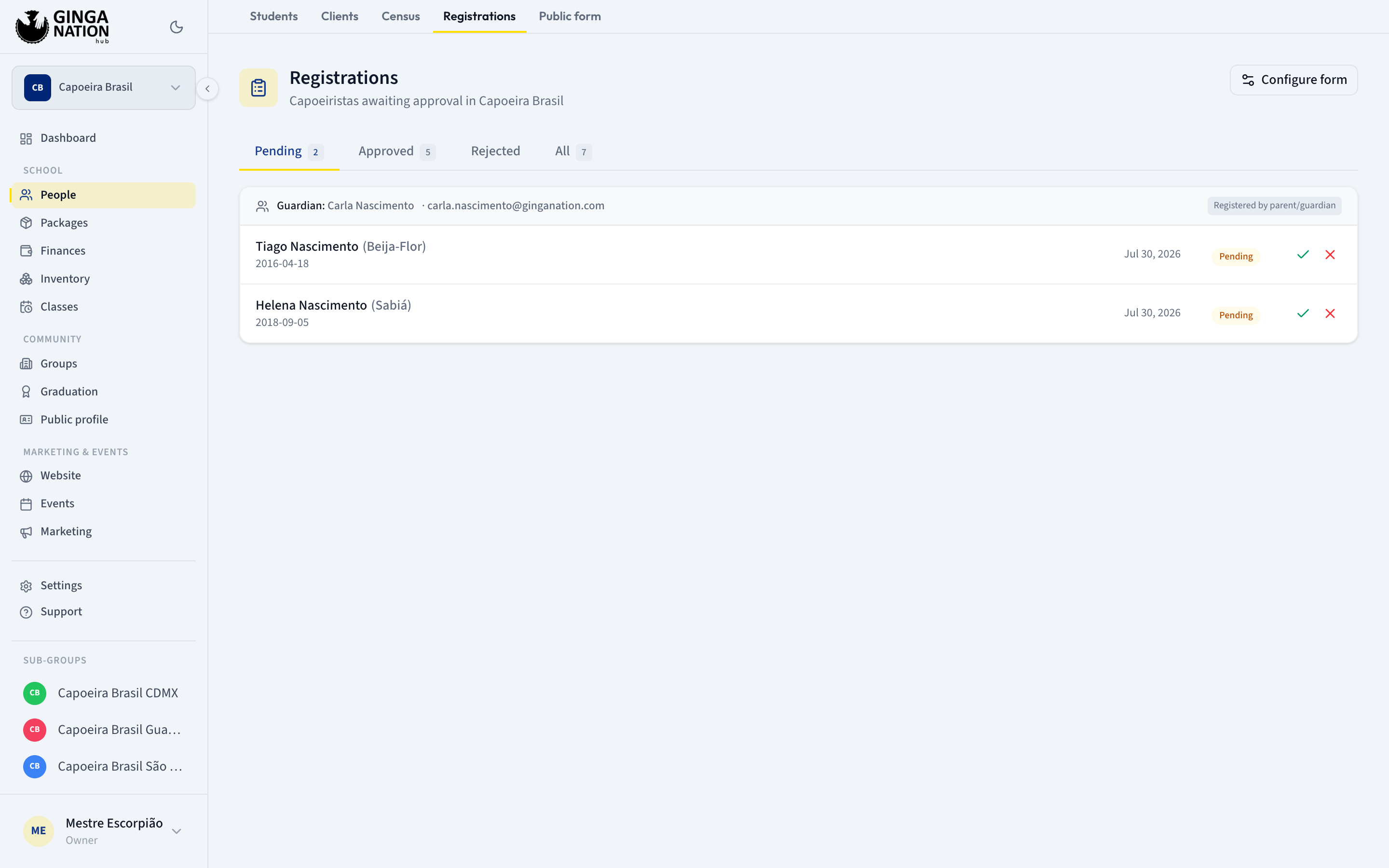 The Registrations queue on the Pending tab, with a guardian's two children grouped under one card